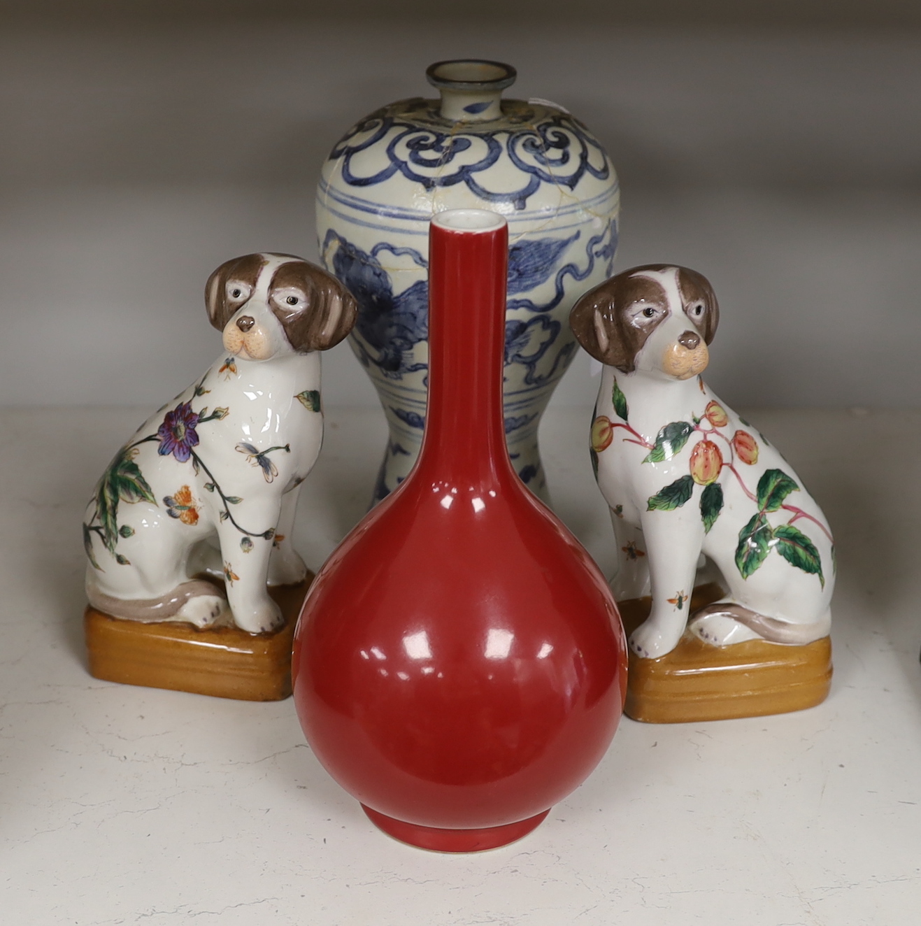 A Chinese blue and white Meiping, a copper red glaze vase and a pair of dog figures, tallest 30cm